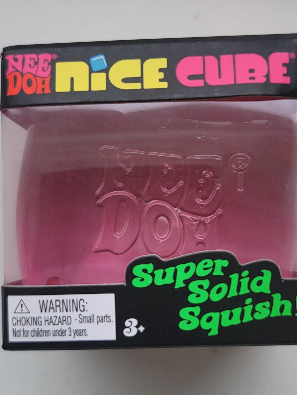 New NeeDoh Nice Cube -  Translucent Pink Squish Toy by Schylling